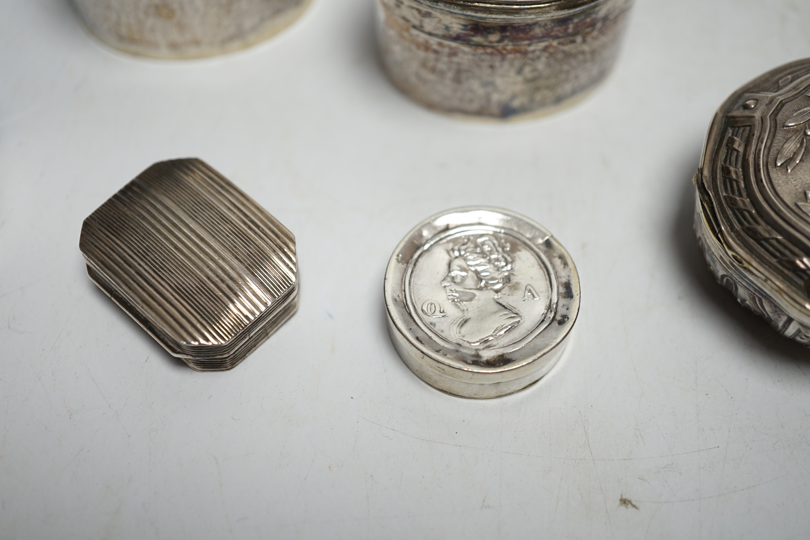 Assorted silver and white metal pill boxes, including Dutch, together with a 19th century vinaigrette by Samuel Pemberton, 30mm.